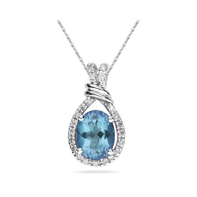 Oval Shaped Blue Topaz and Diamonds Pendant in White Gold