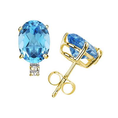 7X5mm Oval Blue Topaz and Diamond Stud Earrings in 14K Yellow Gold