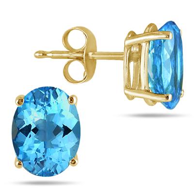 All-Natural Genuine 7x5 mm, Oval Blue Topaz earrings set in 14k Yellow gold