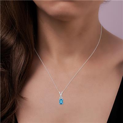 14K White Gold 8x6MM Emerald Shaped Blue Topaz and Three Stone Diamond Pendant