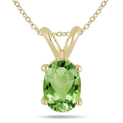 All-Natural Genuine 6x4 mm, Oval Peridot pendant set in 14k Yellow gold