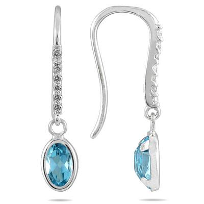 1 1/5 Carat Bezel Set Oval Blue Topaz and Diamond Earrings in 10K White Gold