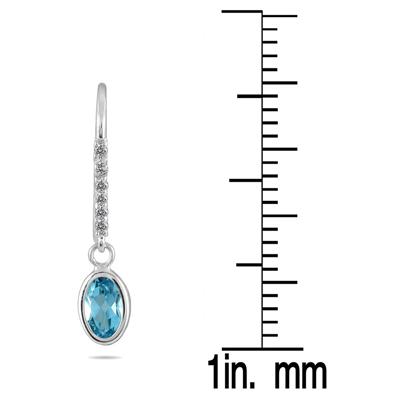 1 1/5 Carat Bezel Set Oval Blue Topaz and Diamond Earrings in 10K White Gold