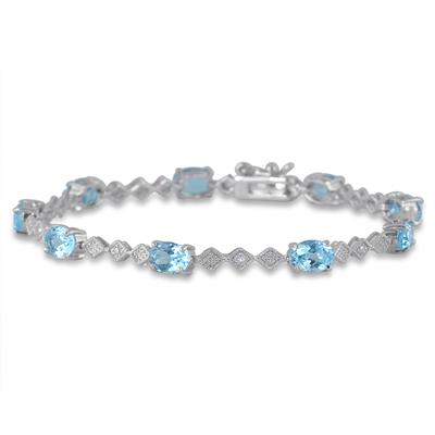 10 Carat Oval Blue Topaz and Diamond Bracelet in Rhodium Plated Brass